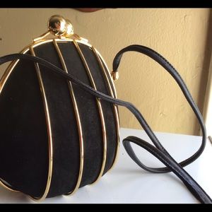 Rodo cocktail bag black with gold trim used very slightly very clean